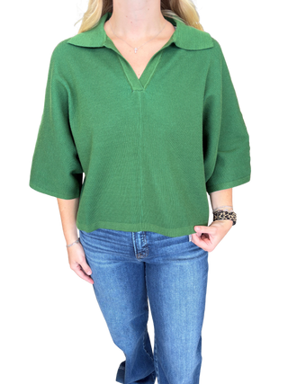 Solid 3/4 sleeve knit top featuring open V-neck collar