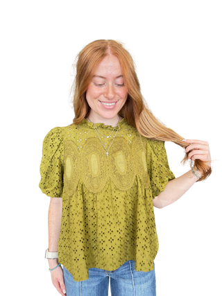 Solid short puff sleeve top with a ruffled neckline