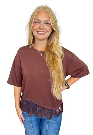 Solid short sleeve knit top featuring scallop lace hem detail