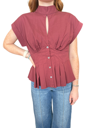 Solid ¾ puff sleeve top featuring V-neck and bow tie detail