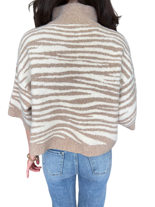 Abstract animal print 3/4 sleeve knit top with a stand necK