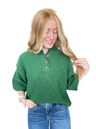 Solid ¾ sleeve sweater top with a stand collar and partial button closure