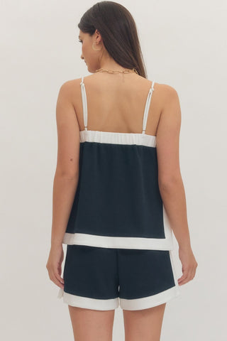 Solid sleeveless top featuring square neck and adjustable shoulder straps