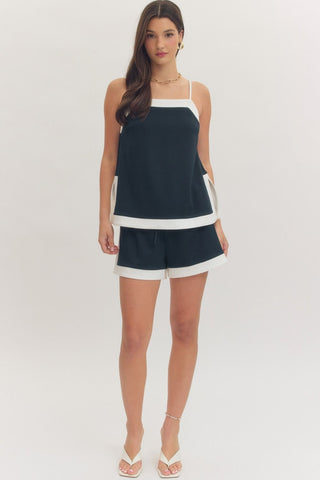 Solid sleeveless top featuring square neck and adjustable shoulder straps
