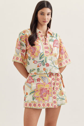 Botanical print short sleeve top featuring split V-neck collar
