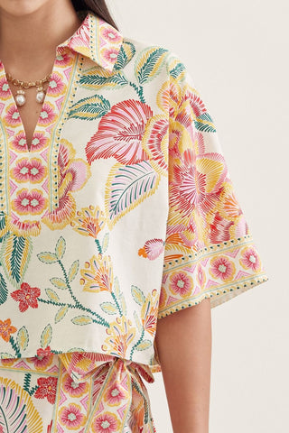 Botanical print short sleeve top featuring split V-neck collar