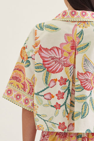 Botanical print short sleeve top featuring split V-neck collar