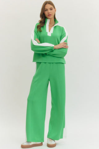 Solid long sleeve knit top featuring contrast collar and contrast stripe detail