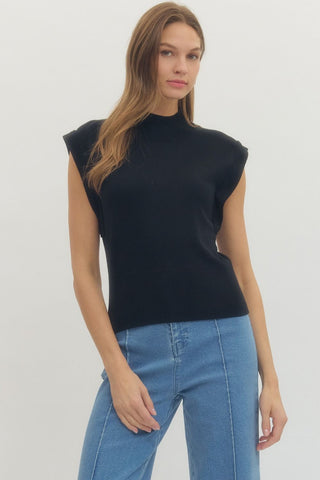 Solid mock neck sleeveless knit top featuring ribbed hem
