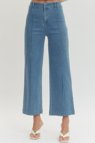 Solid high rise wide leg pants featuring front seam detail