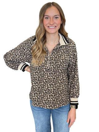 Leopard print long sleeve top featuring zip-up mock neck