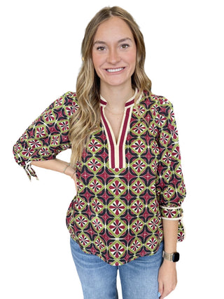 Geometric print 3/4 puff sleeve top featuring contrast trim split V-neck