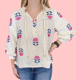 Botanical embroidered 3/4 puff sleeve top featuring ruffle neck detail