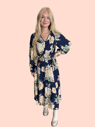 Floral print long sleeve midi dress featuring V-neckline and covered buckle belt.