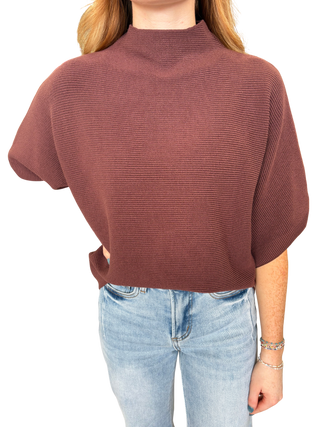 Solid mock neck short sleeve sweater knit top featuring dolman sleeves