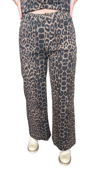 Leopard print pants featuring front pockets