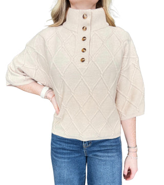 Solid ¾ sleeve sweater top with a stand collar and partial button closure