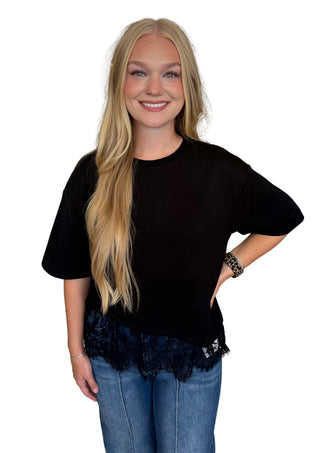 Solid short sleeve knit top featuring scallop lace hem detail