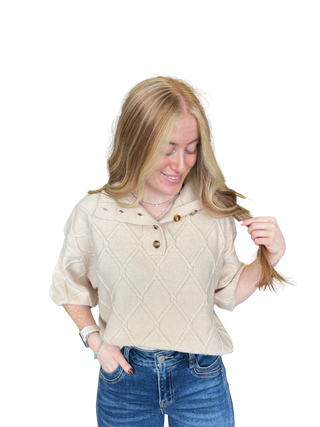 Solid ¾ sleeve sweater top with a stand collar and partial button closure