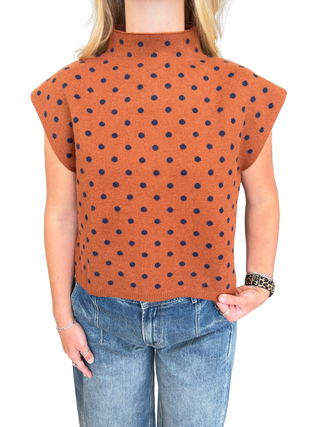 Polka dot mock neck sleeveless top featuring cap sleeve detail